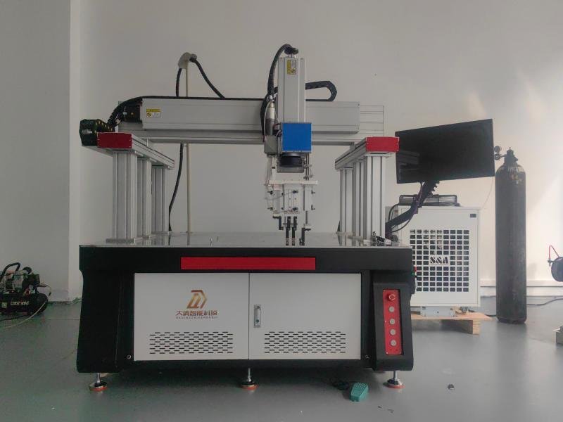 Industrial laser welding machine producing precise welds on metal